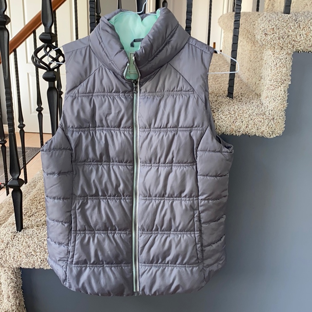 A grey and teal SO vest